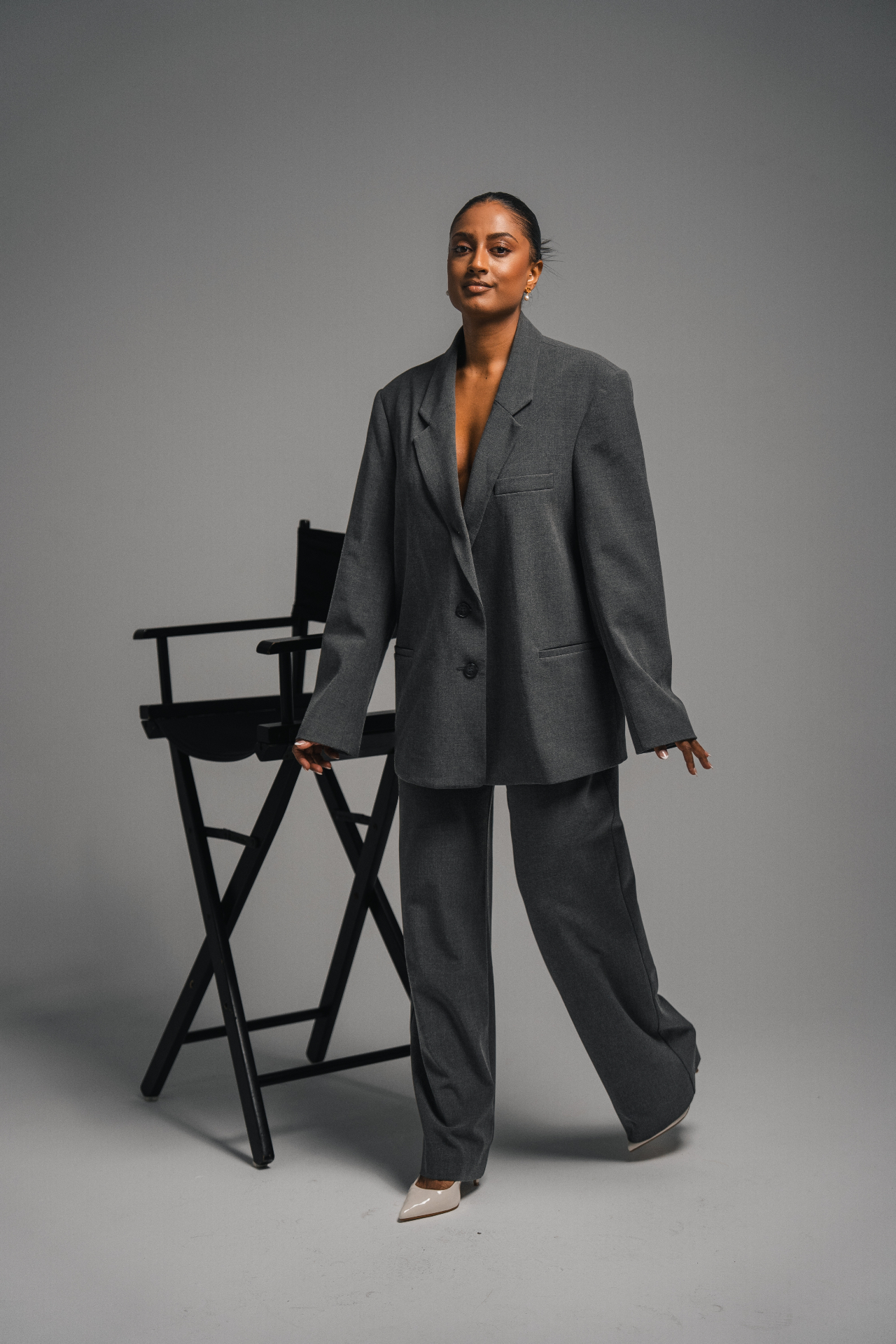 Editorial studio portrait with director's chair