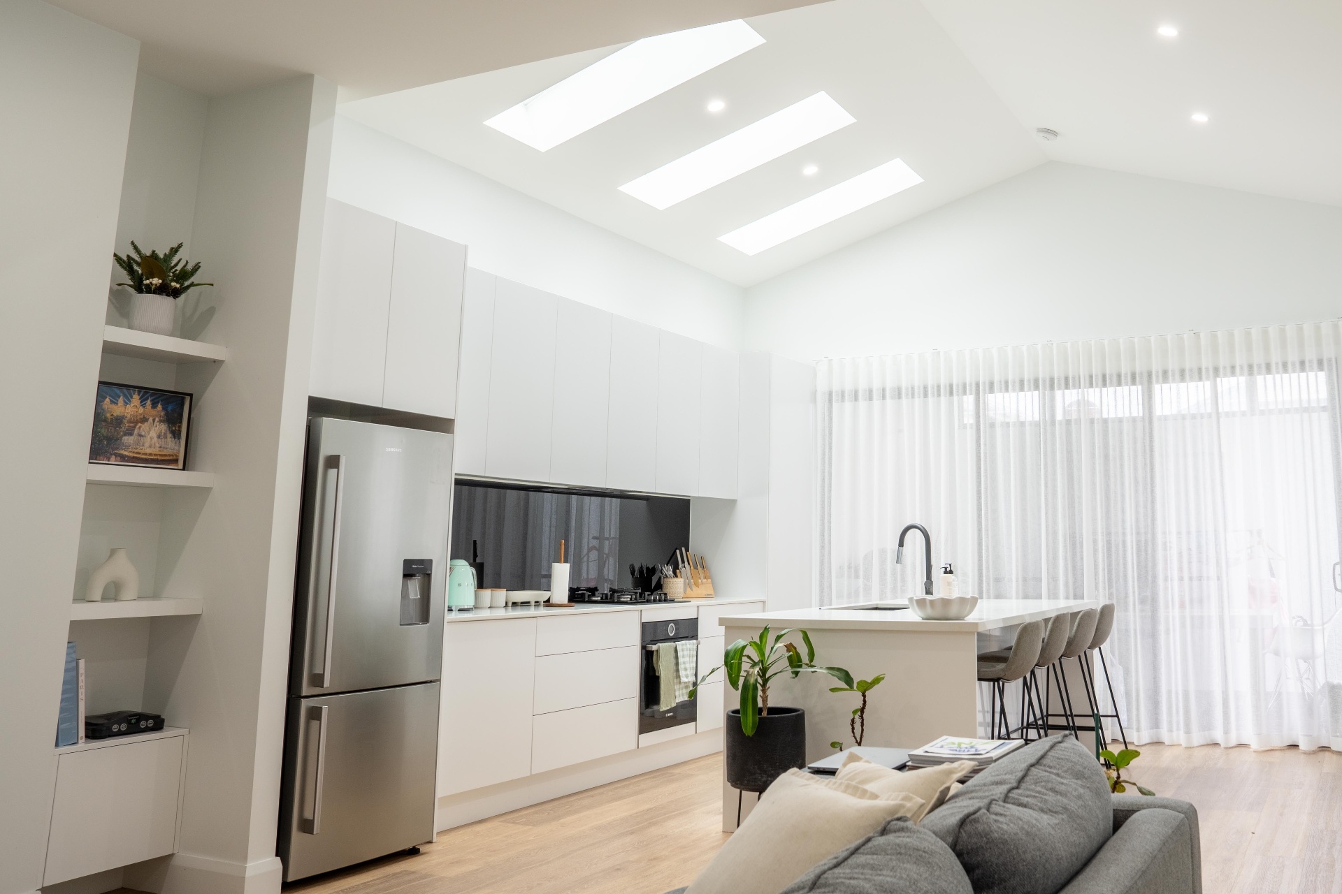 Bright open-plan kitchen with vaulted ceiling