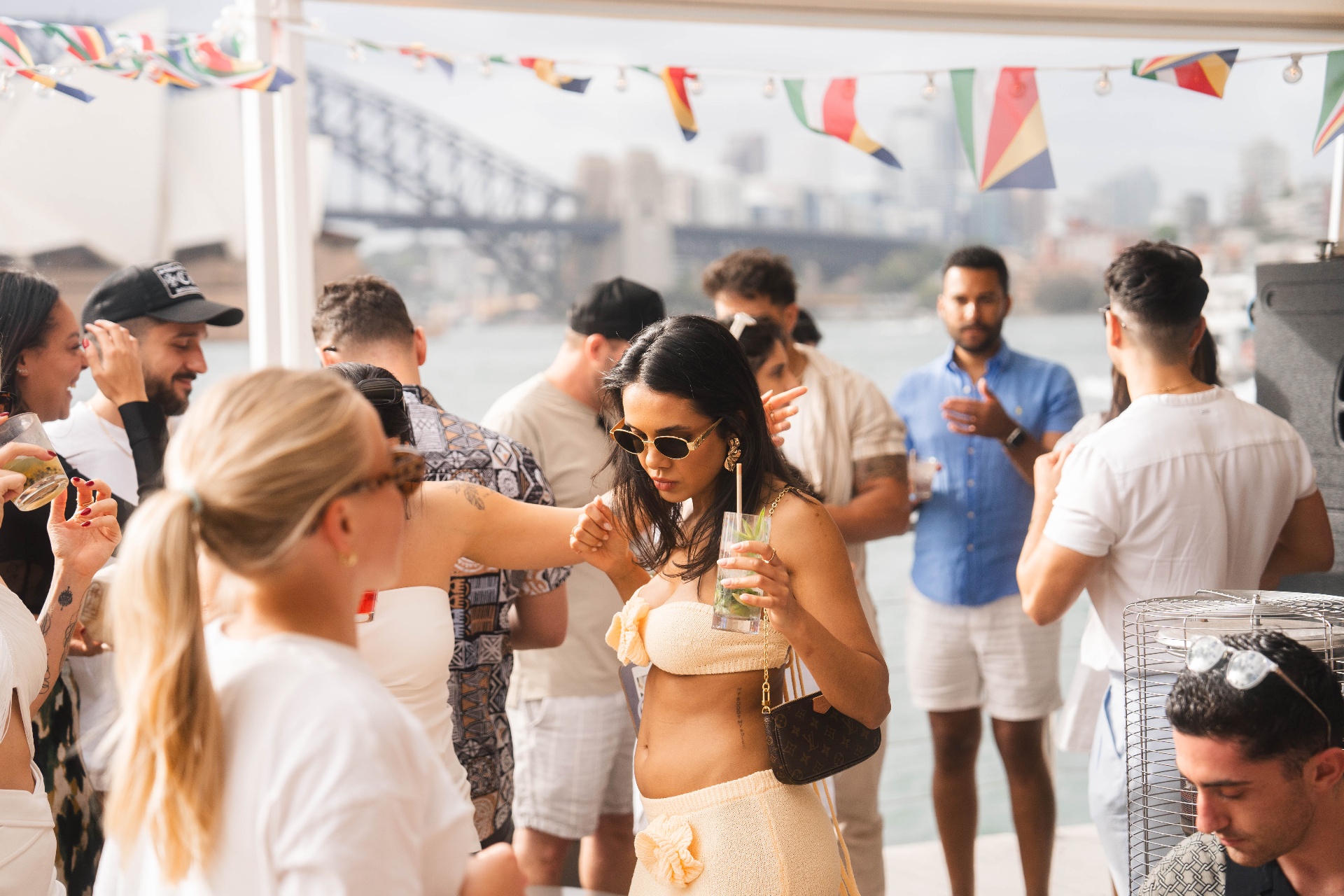 Guest dancing at Takamaka x The Island harbourside party