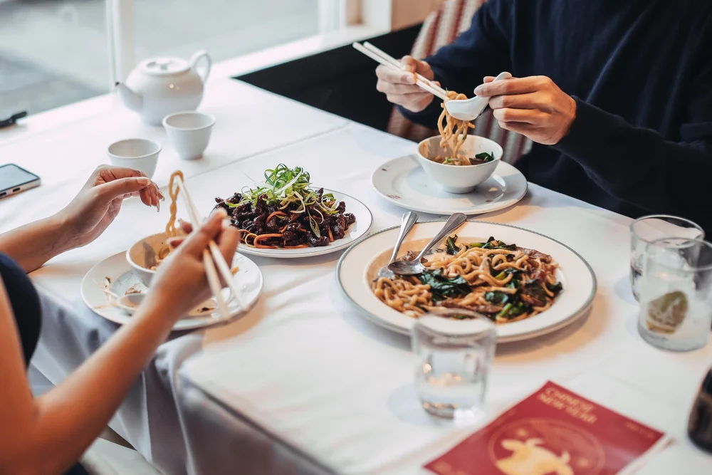 Chinese banquet with noodles and shared plates