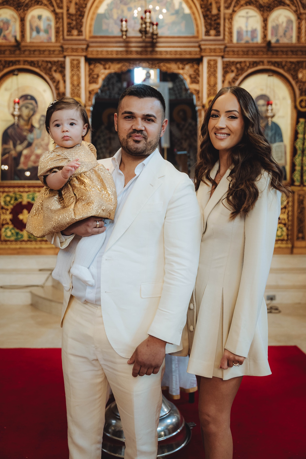 Family portrait at christening ceremony
