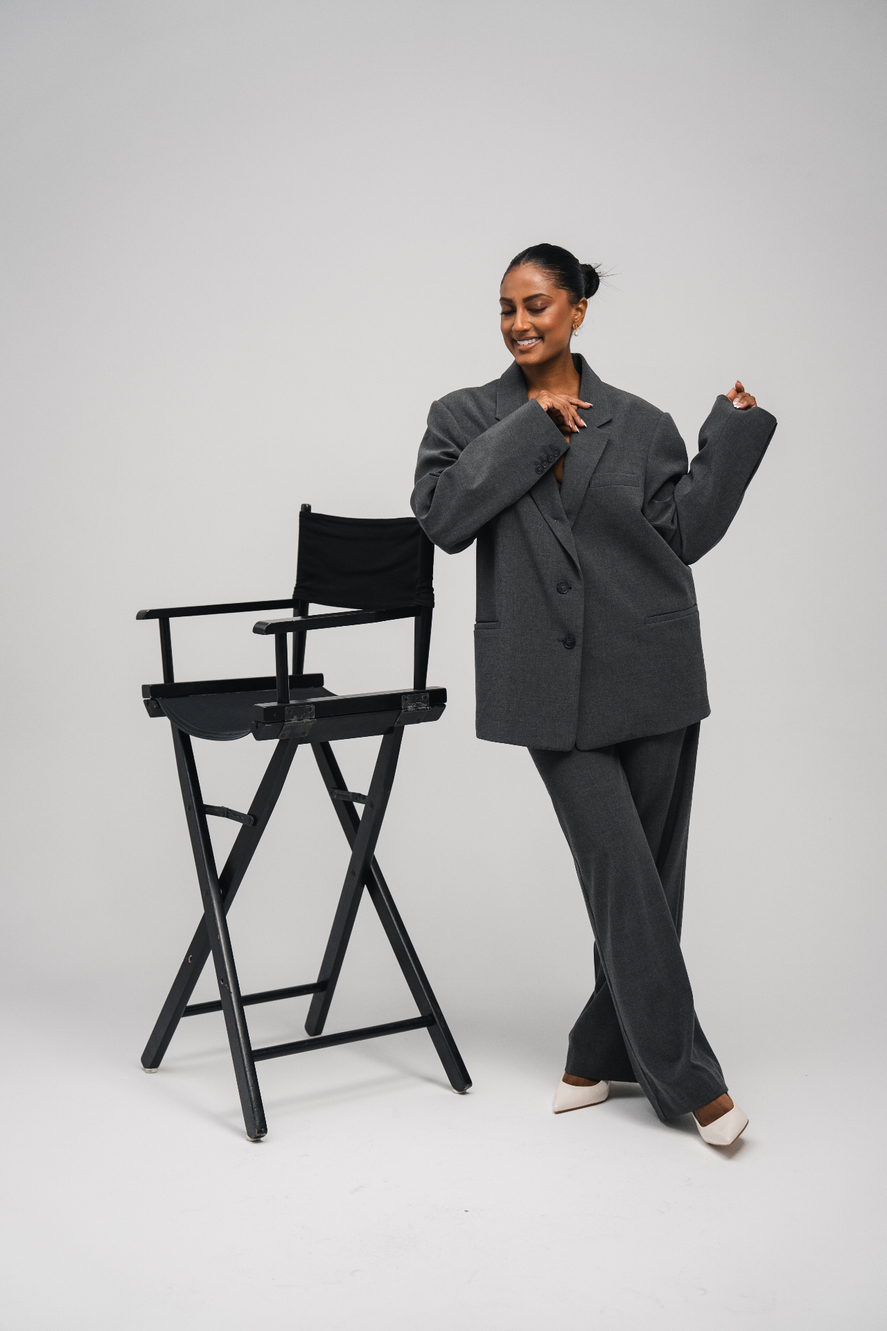 Editorial studio portrait — grey suit